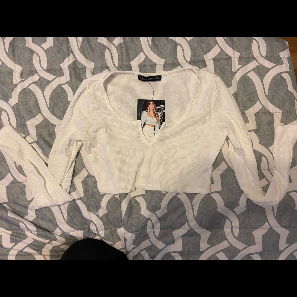 Cute crop top runs a little small.